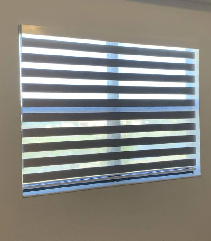 Closed zebra shades offering privacy and light control