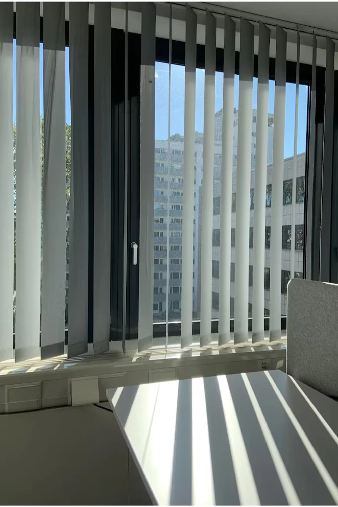 Vertical blinds in modern office window