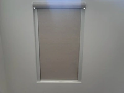 Blackout roller shade installed in large Miami kitchen window