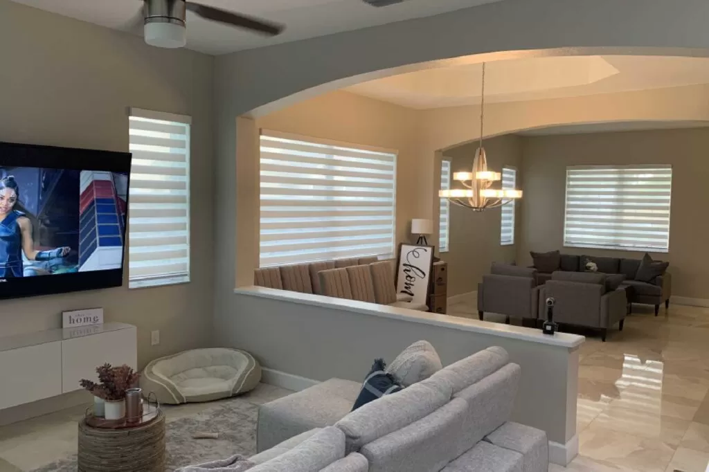 Bright living room with modern zebra blinds on all windows